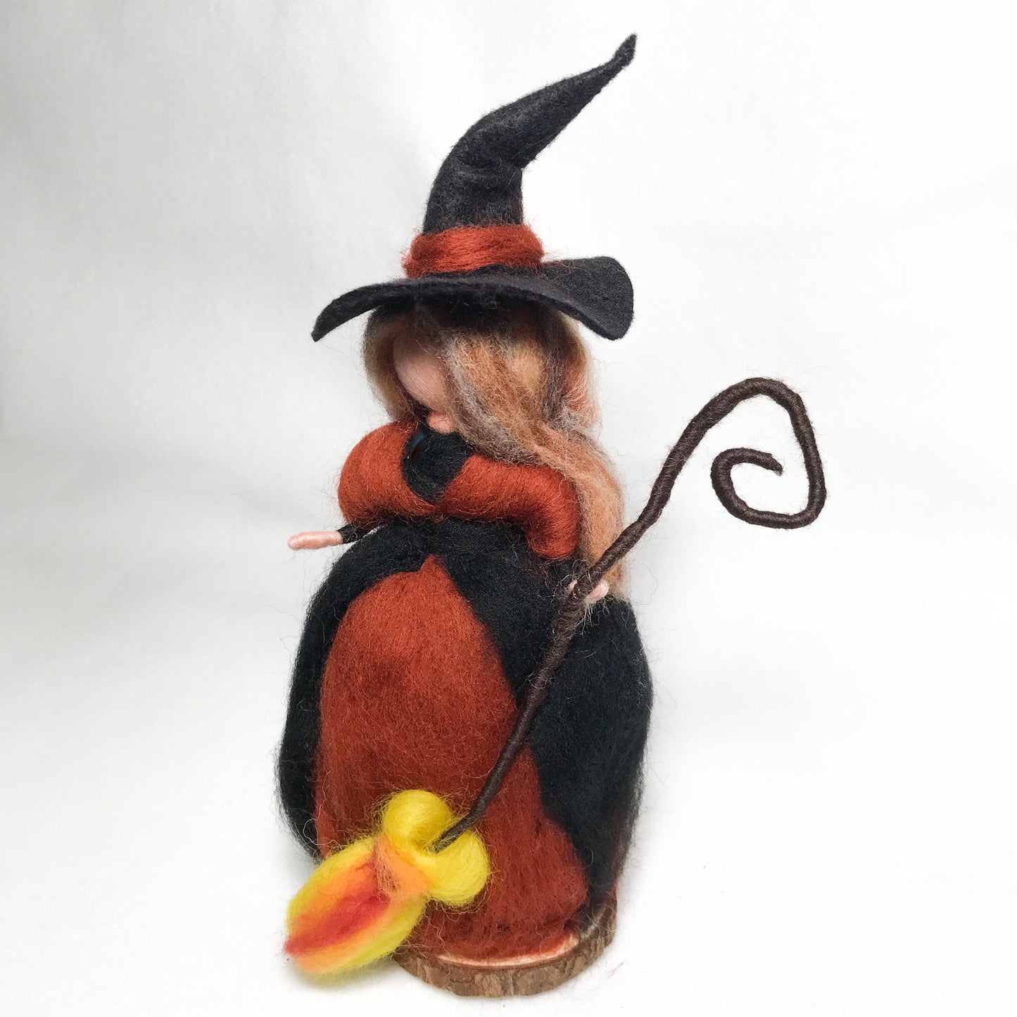 Wise Autumn Witch with a fire broom, by Rachel Mack
