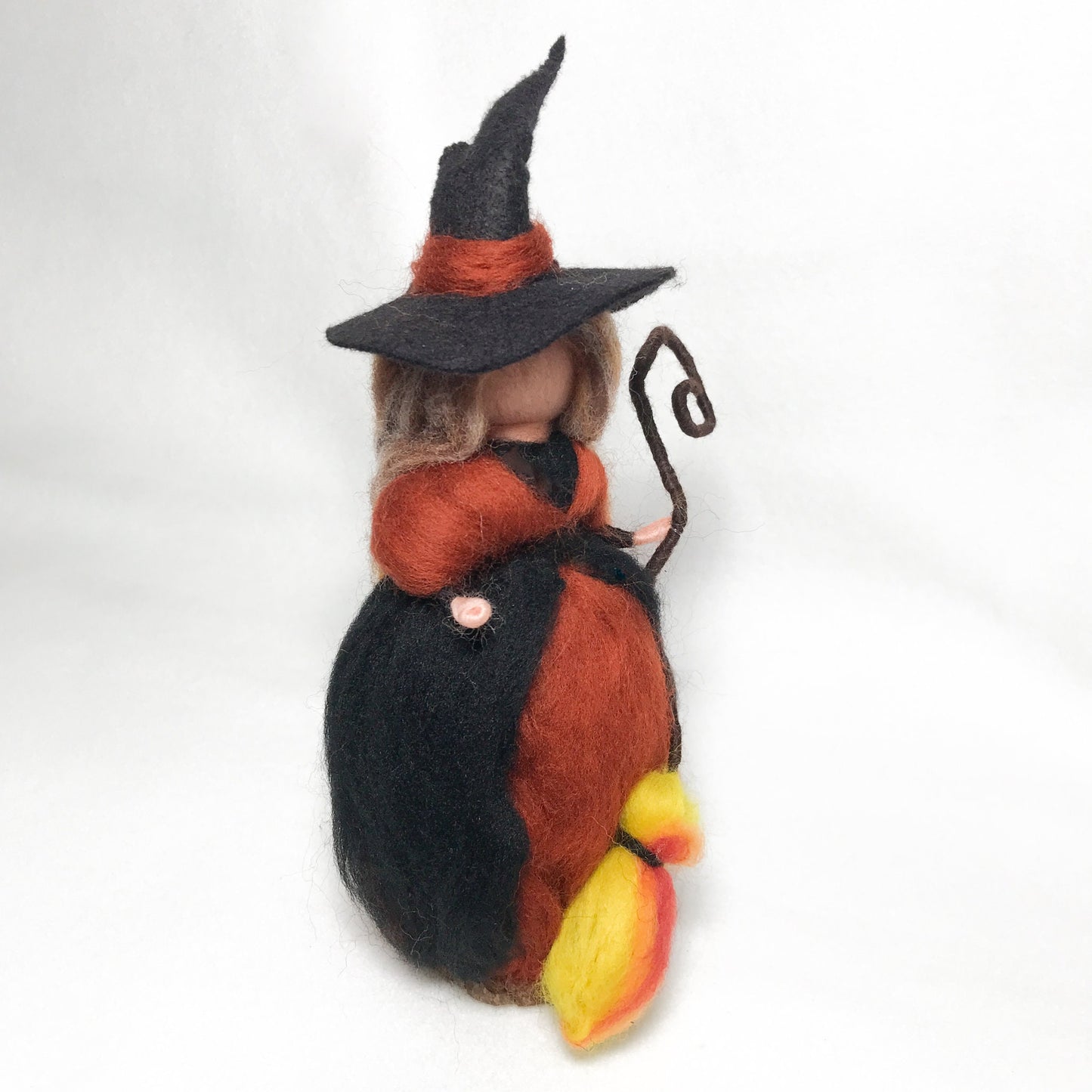 Wise Autumn Witch with a fire broom, by Rachel Mack