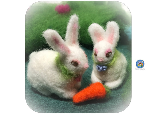 Needle felted white bunny with a carrot.